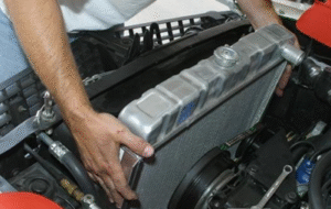 Image of technician installing radiator